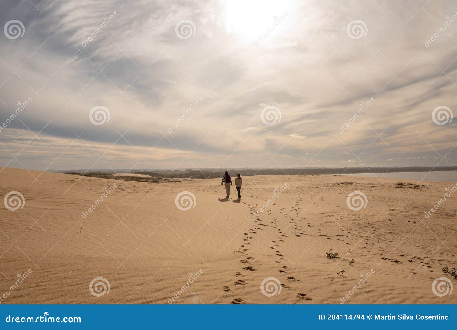 two womens walks through the dunes of the cabo polonia national park in the department of rocha in uruguay