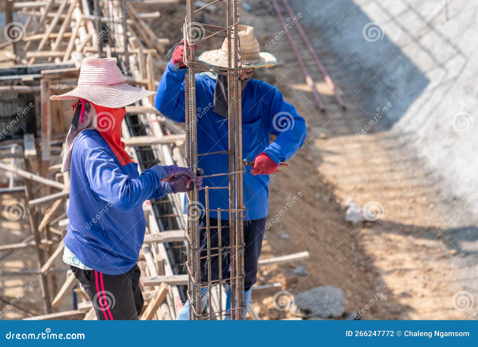 Two Worker Wire Bundle Steel Rod for Concrete Pole Editorial