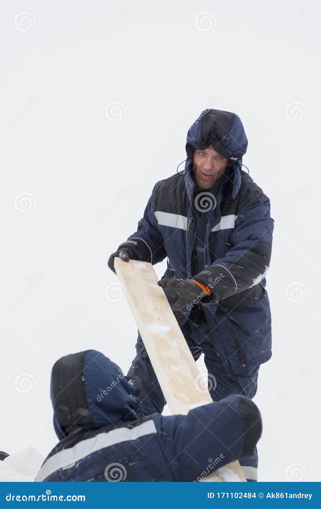 Two Workers in Overalls at a Construction Site Stock Photo Image of