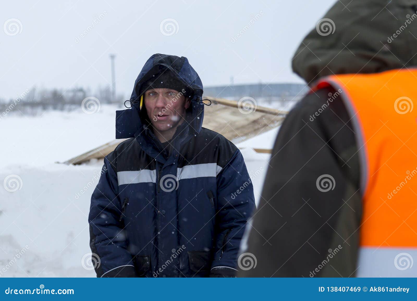 Two Workers in Overalls at a Construction Site Stock Image Image of