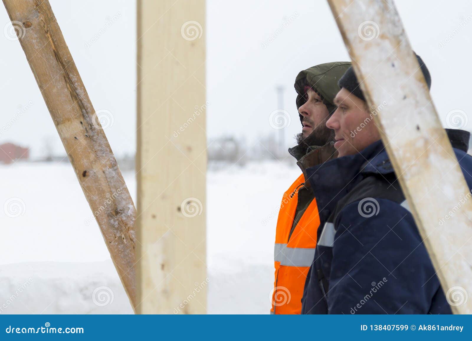 Two Workers in Overalls at a Construction Site Stock Image Image of