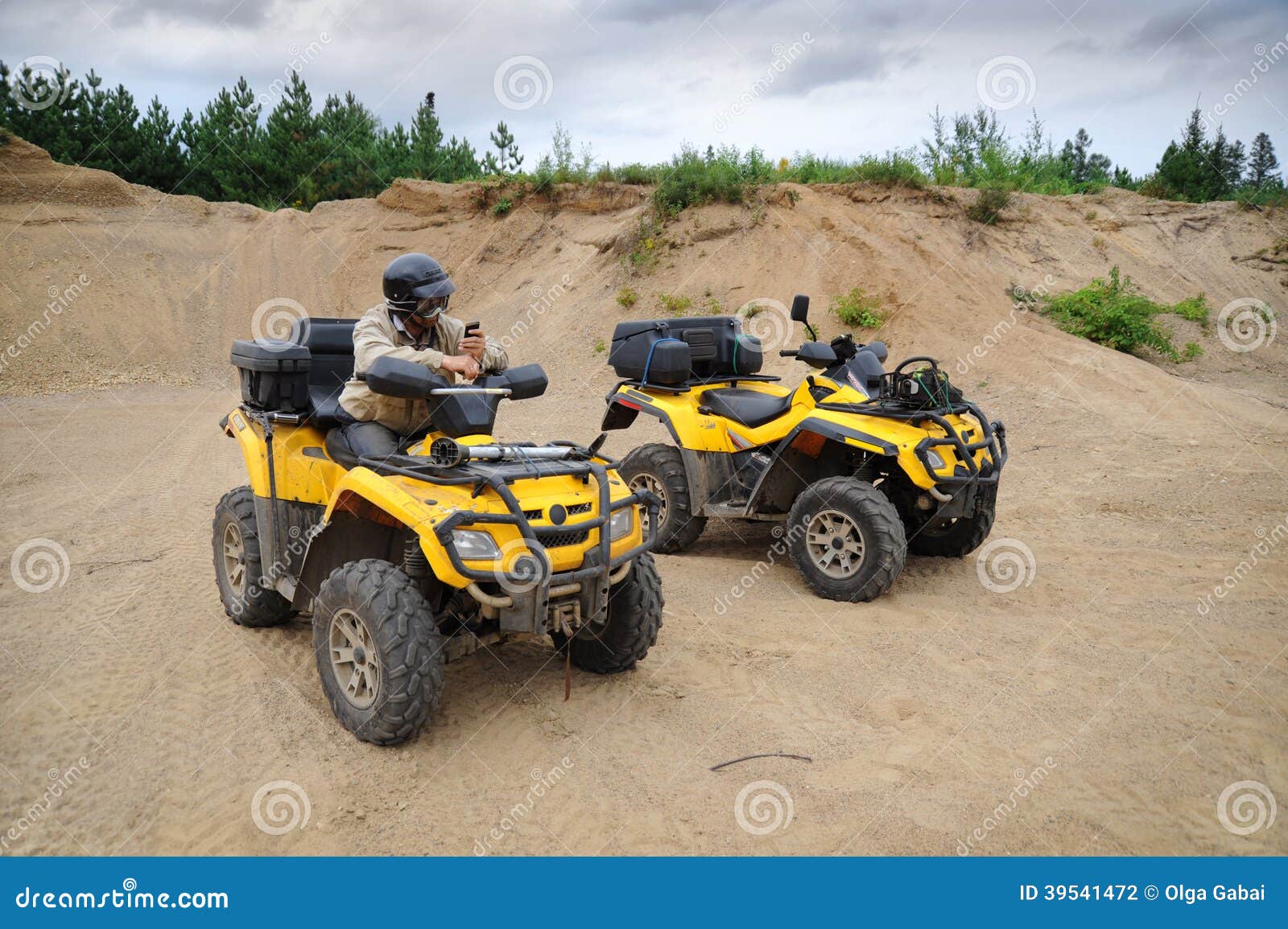 Two yellow ATV stock photo. Image of parked, green, wheel 39541472