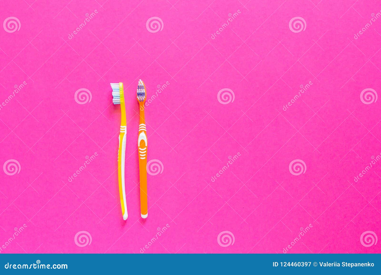 Two Yellow and Orange Plastic Toothbrushes are Located on the Le Stock ...