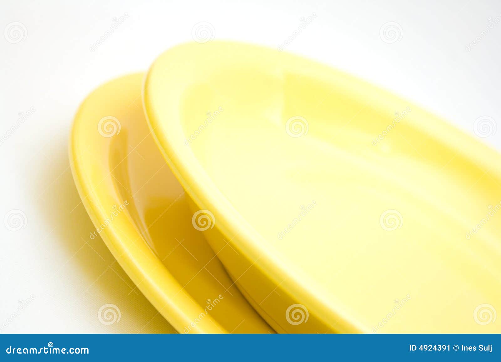 Two yellow plates stock image. Image of ceramic, isolated 4924391