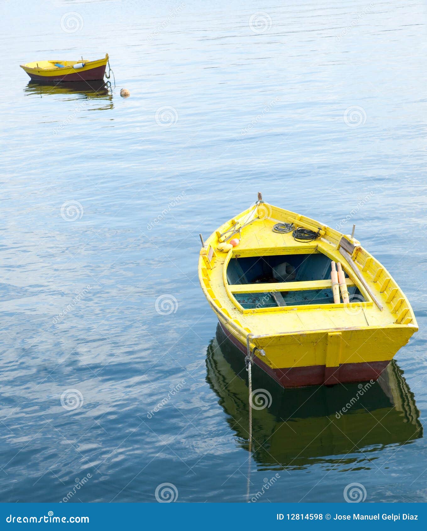 Two yellow rowing boats stock photo. Image of solitude 12814598