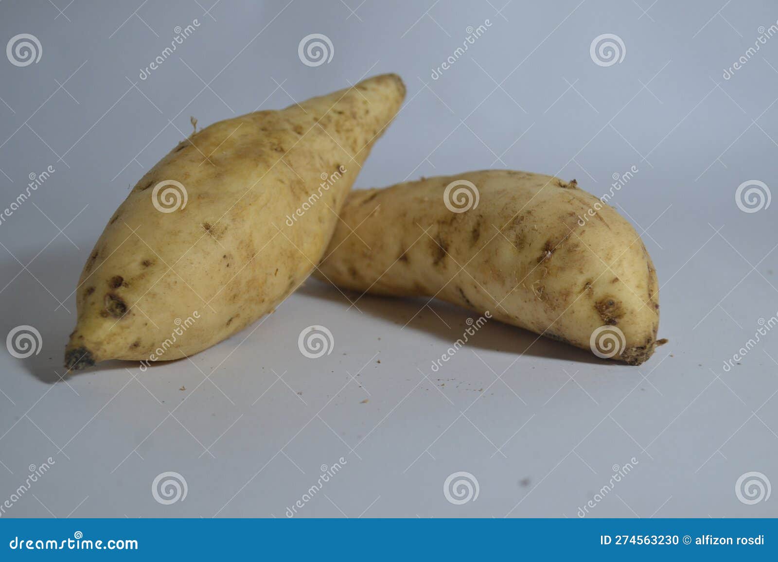 Two Yellow Yam Potatoes on a White Surface Stock Photo Image of crop