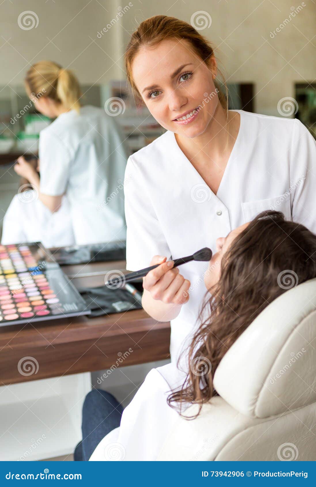 Two Young Beautician Students Working during Make Up Classes Stock