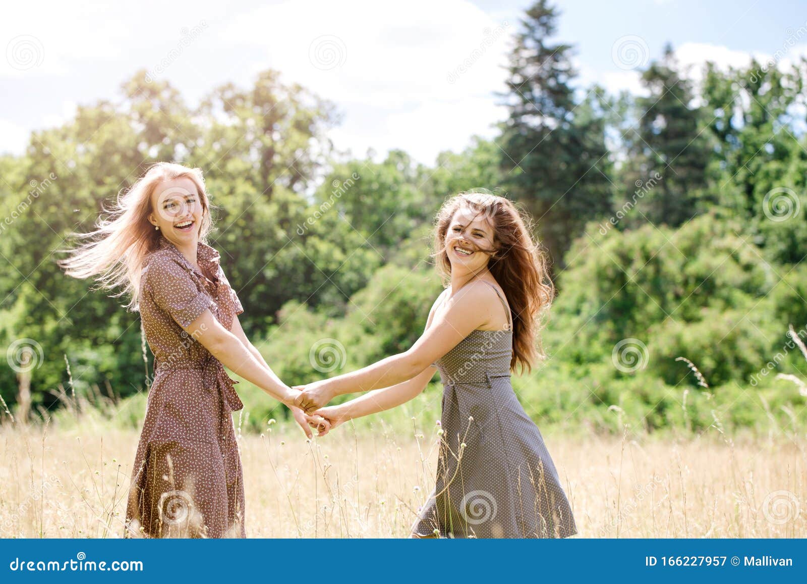 Two Young Beautiful Cheerful Girls Having Fun On The Meadow Stock Image Image Of Caucasian 