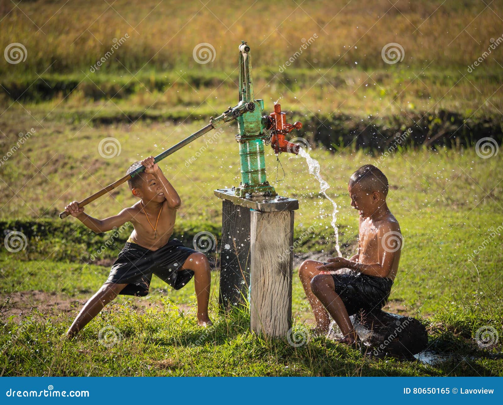 two young boy rocking groundwater bathe in the hot days.