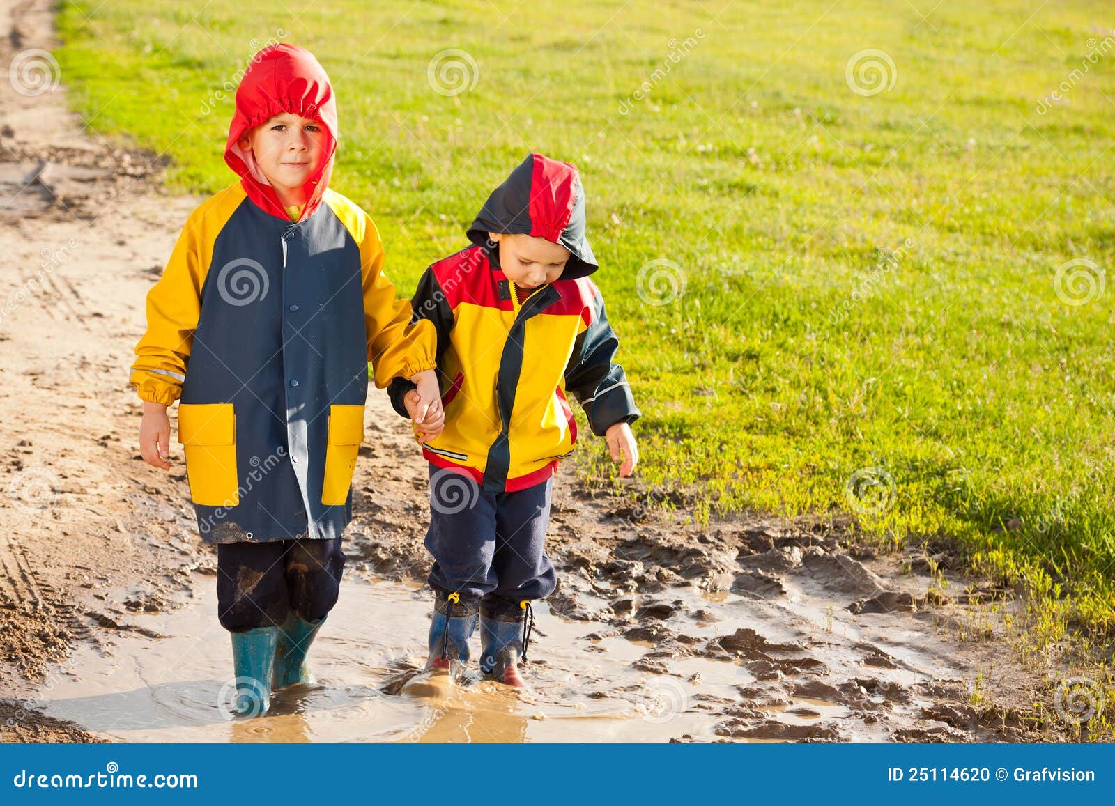 Two young brothers stock photo. Image of raincoat, brother 25114620