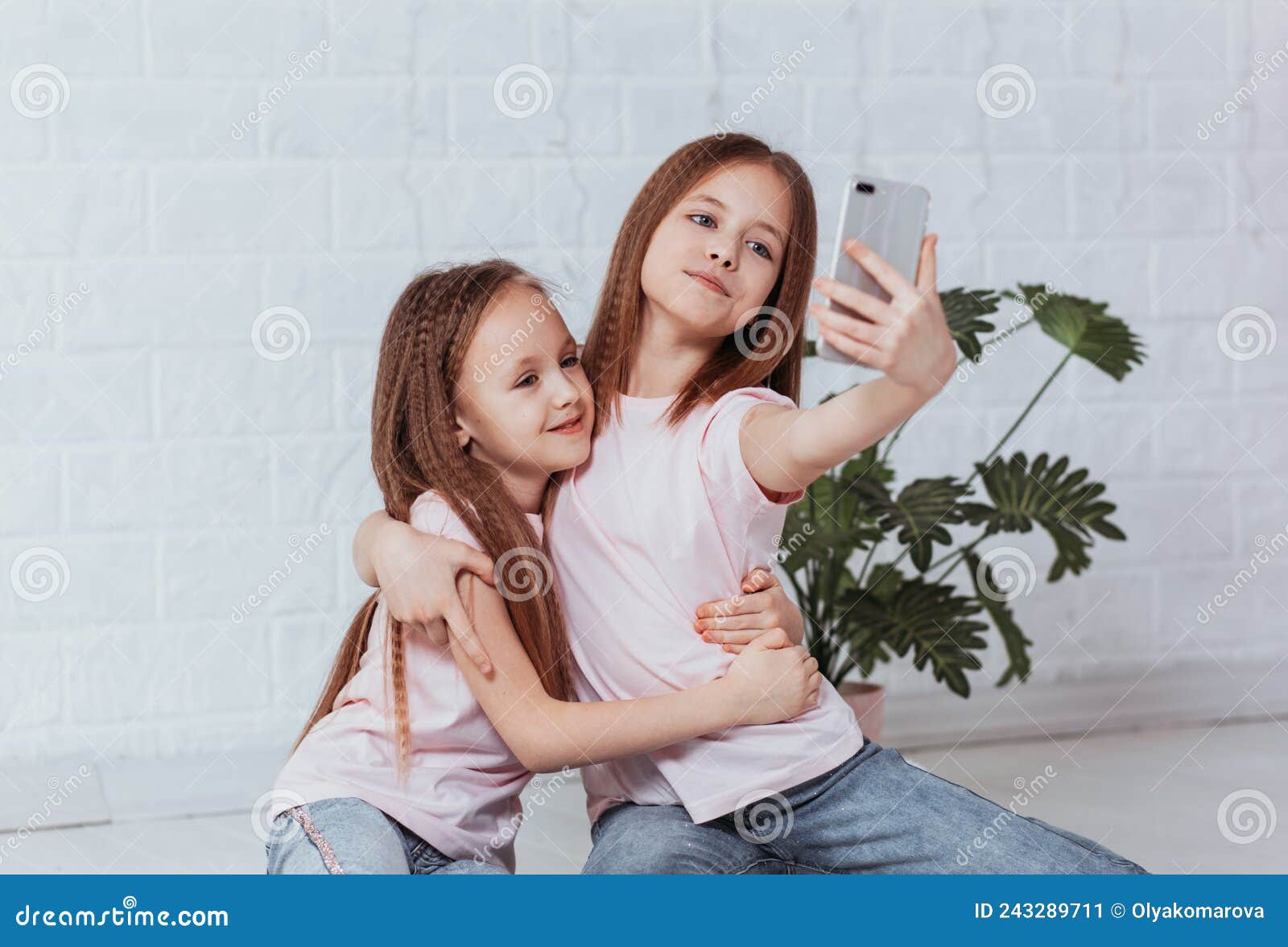 Two Young Smiling Hipster Blond Sisters. Girls Taking Selfie Self ...