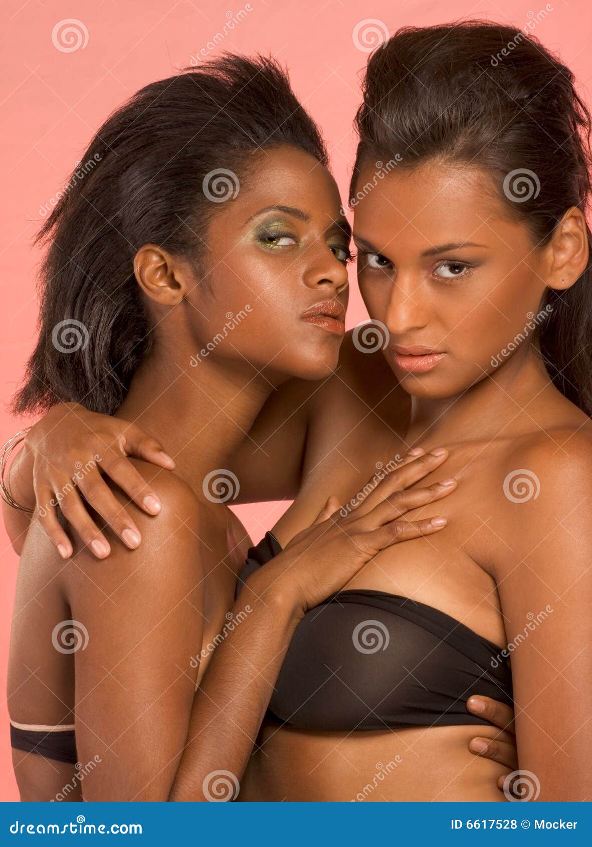 Two Young Ethnic Women in Lingerie Hugging Stock Photo image