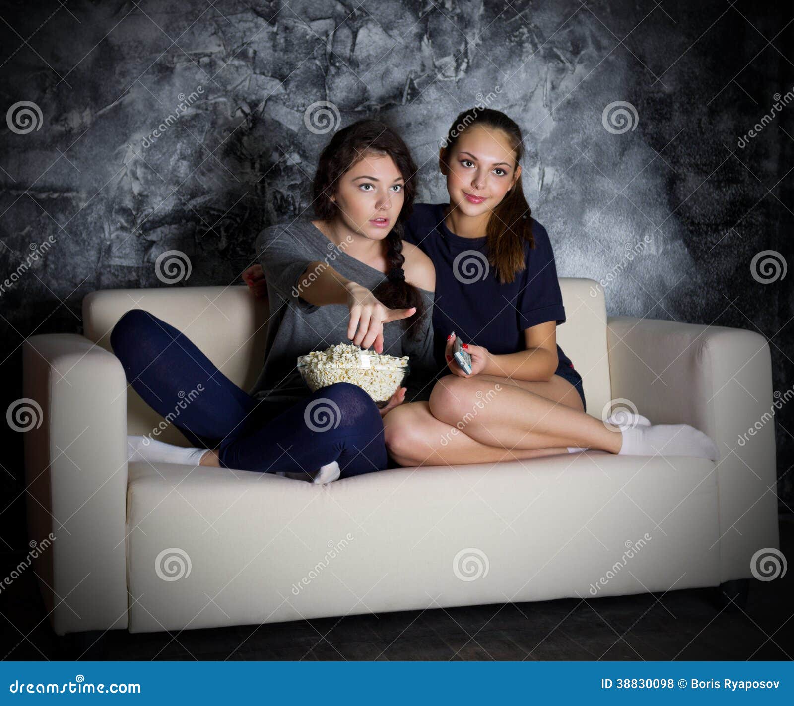 Two young girls looks TV stock photo. Image of household - 38830098