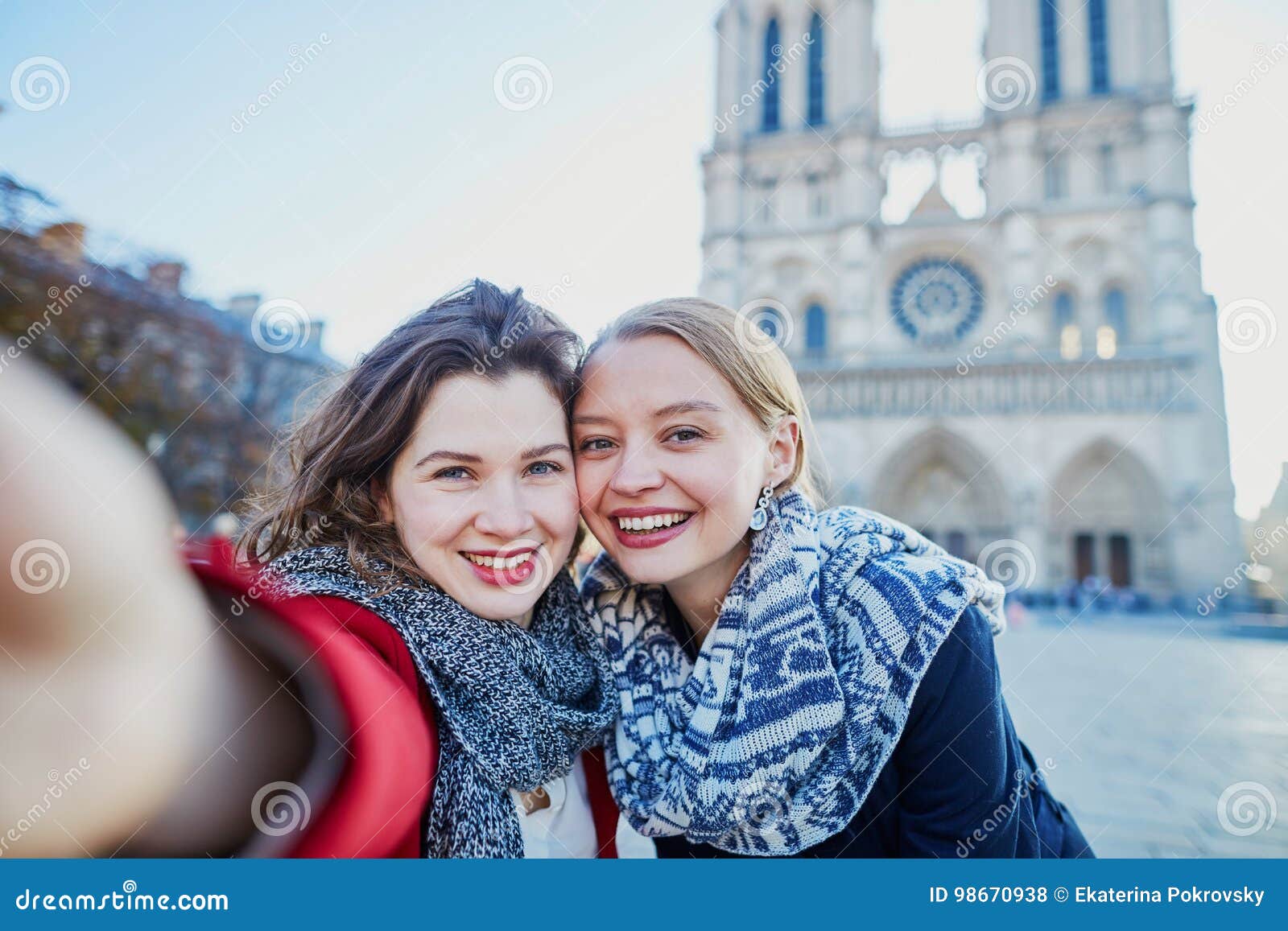 Two Young Girls Taking Selfie Near Notre-Dame in Paris Stock Photo ...