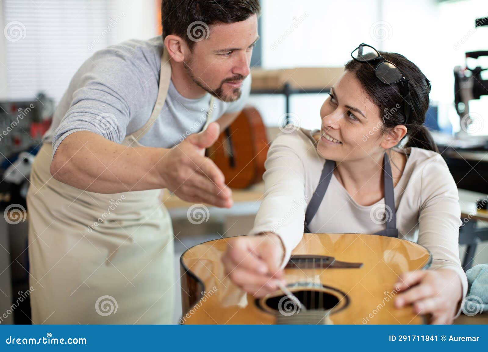 Two Young People Fixing Guitars Stock Image Image of flirt, smiling