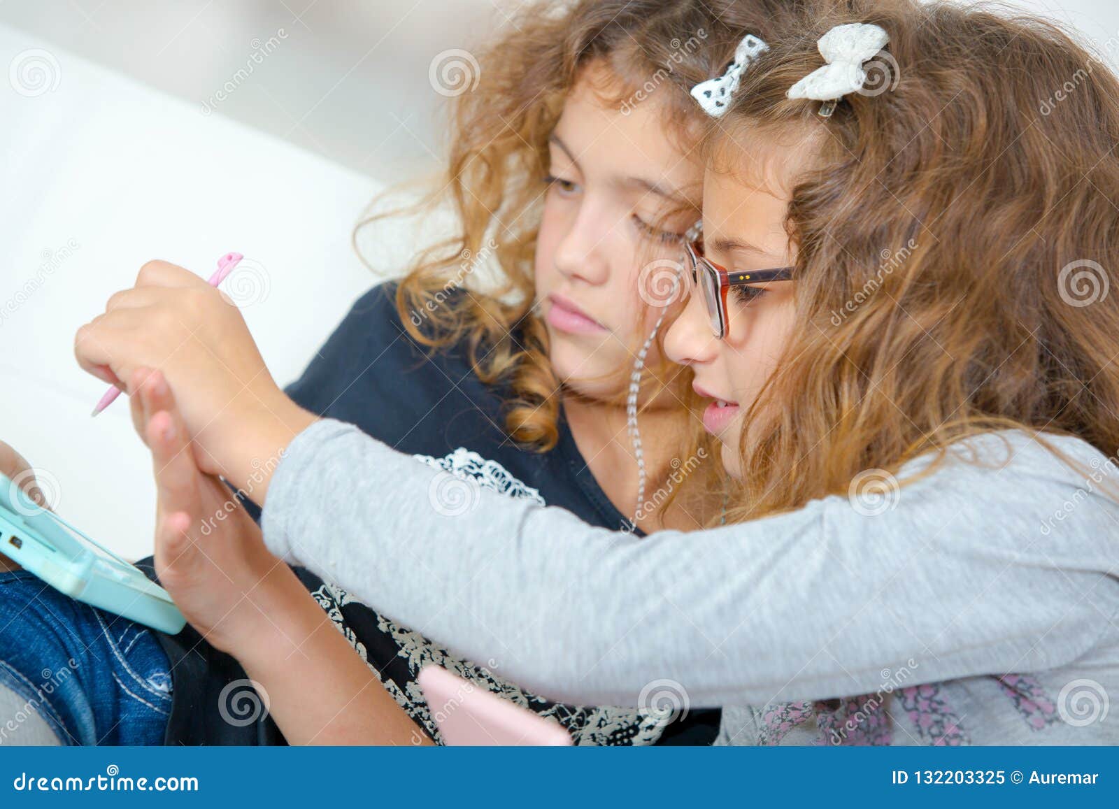 two young sisters playing video gales
