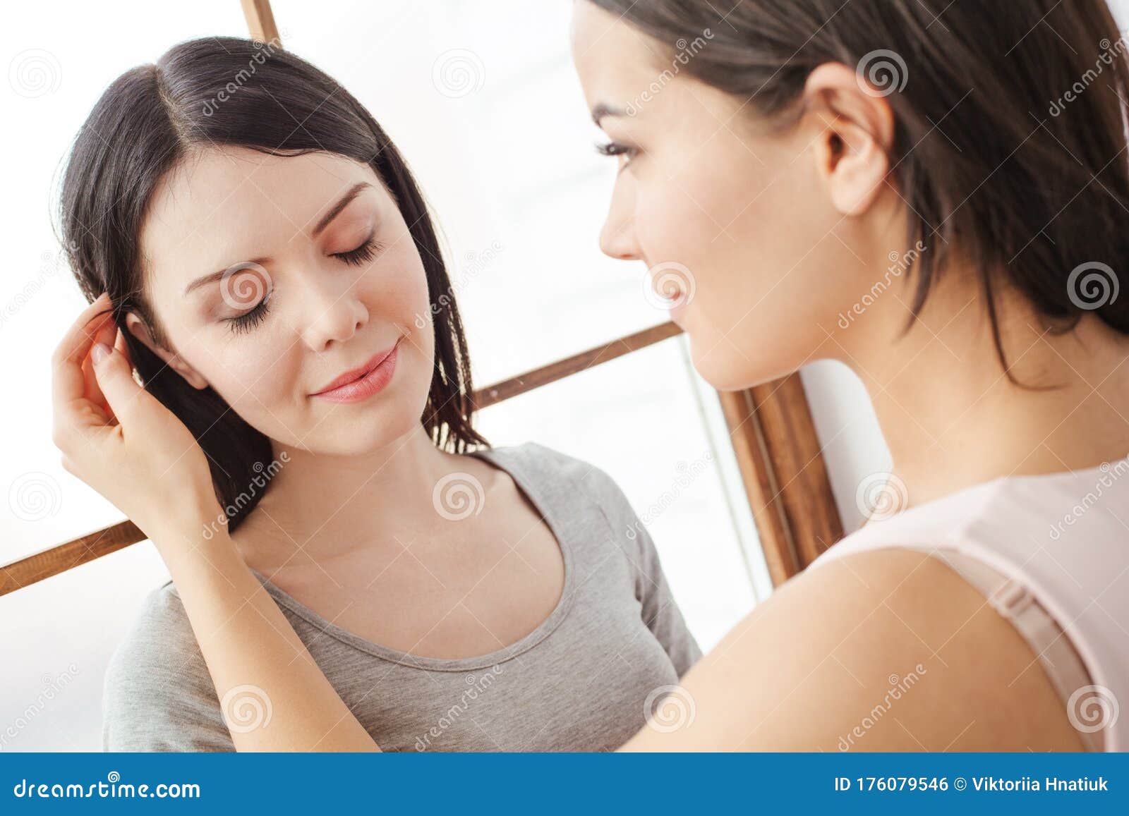 Lesbian Couple In Bedroom At Home Standing One Woman