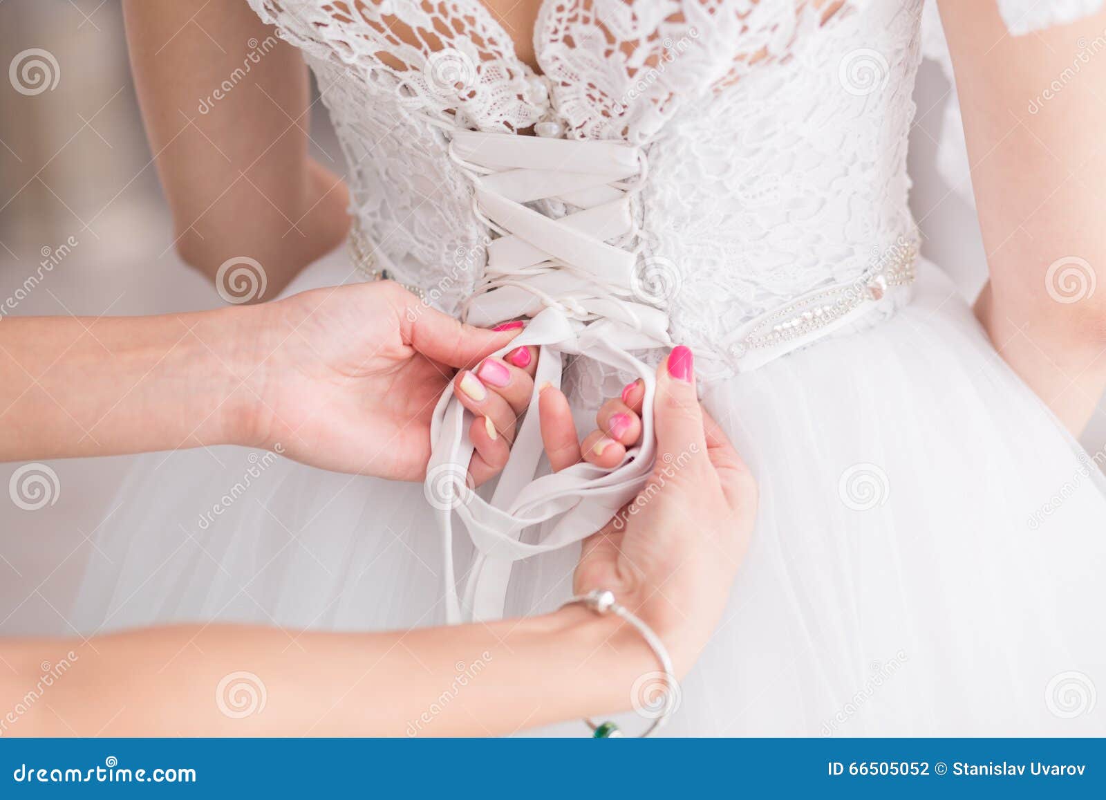 Tying Ribbons on a Wedding Dress Stock Photo Image of female, beauty