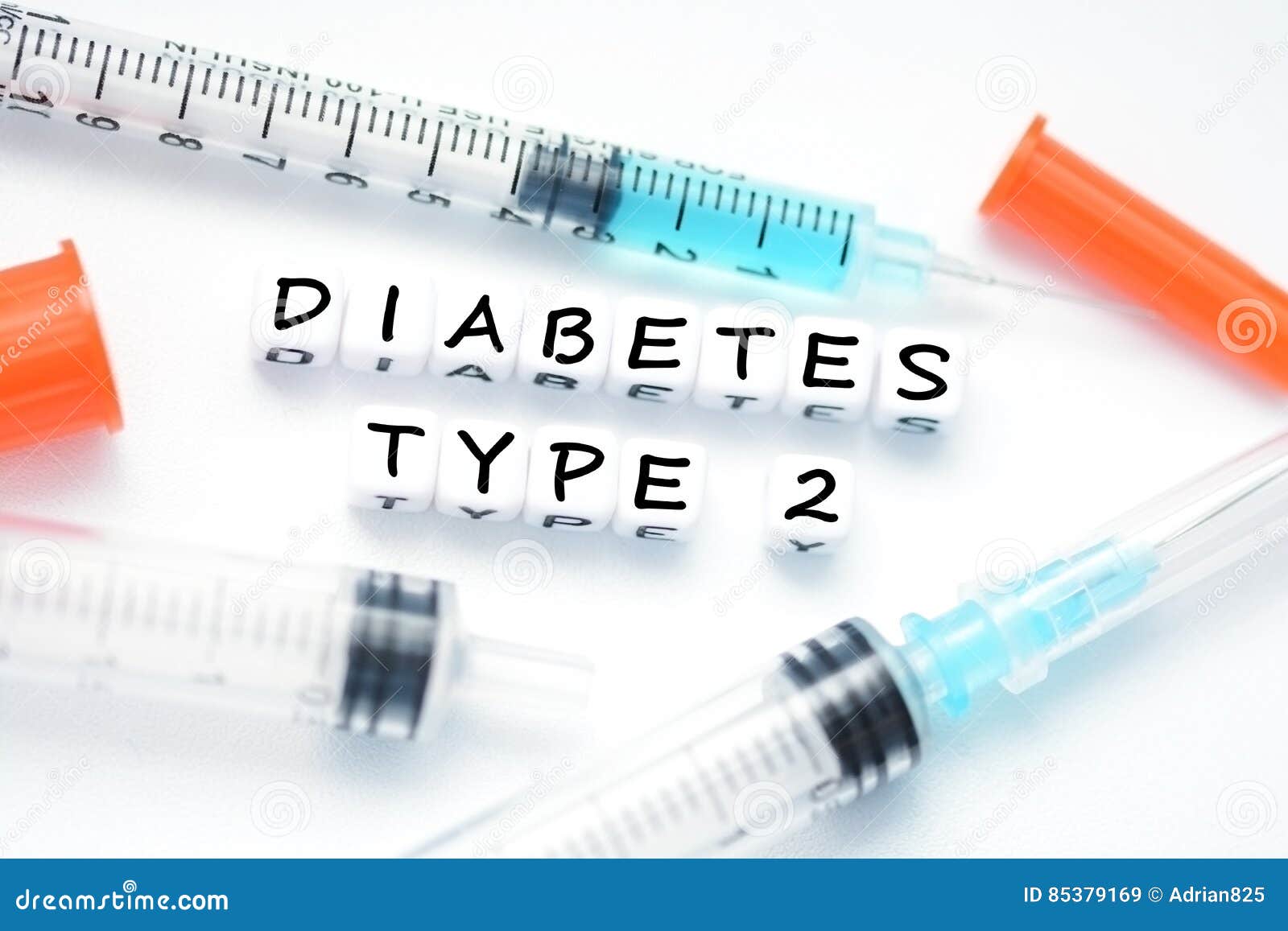 type 2 diabetes text spelled with plastic letter beads placed next to an insulin syringe