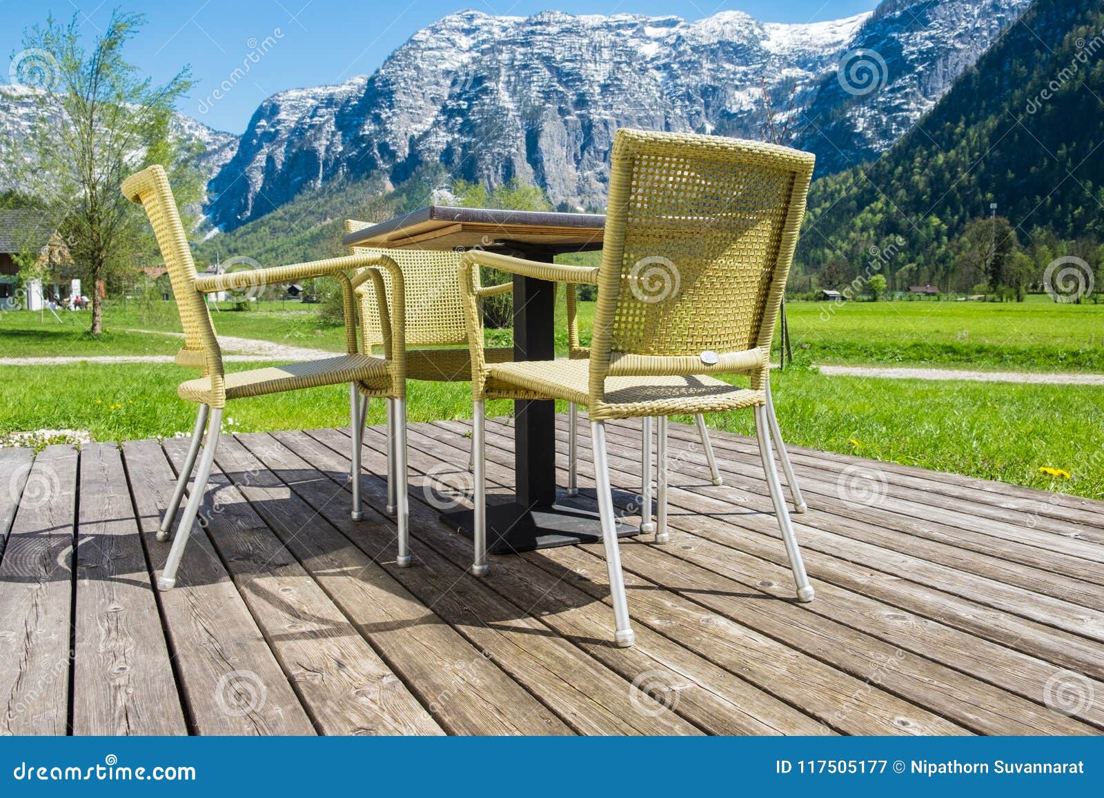 Backyard Chair On Wooden Floor With Mountains Alps Peaks