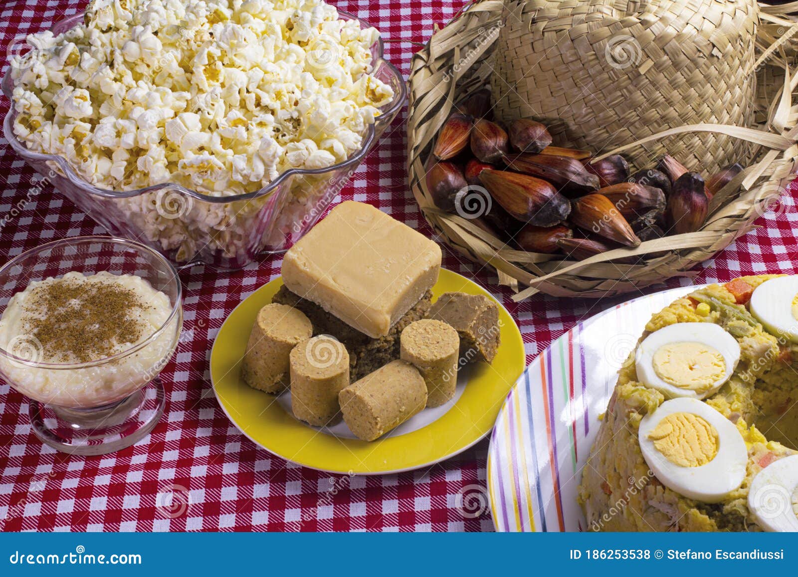 typical brazilian junina party food and sweets. couscouz, peanut candy, sweet rice, dulces de leche and and pine nuts