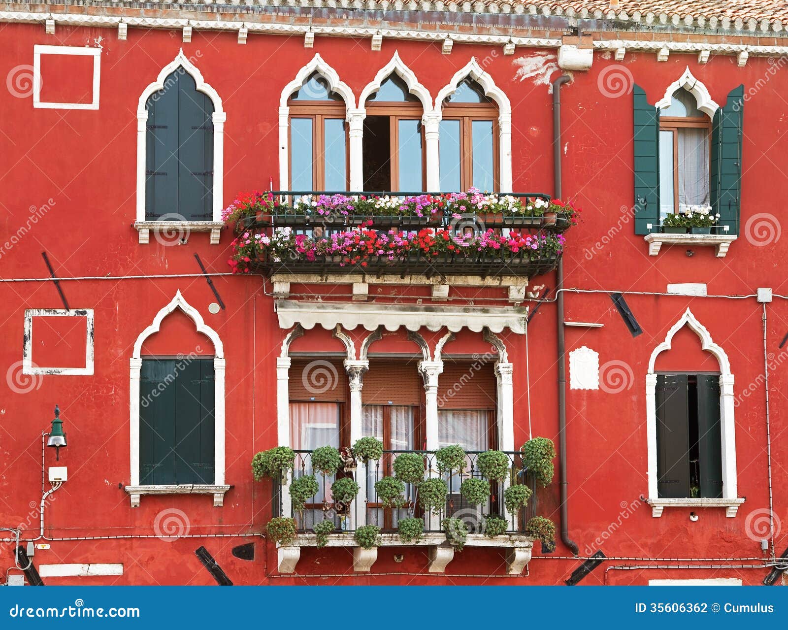 Typical Facade in Venice with Decorative Flowers. Stock Photo Image
