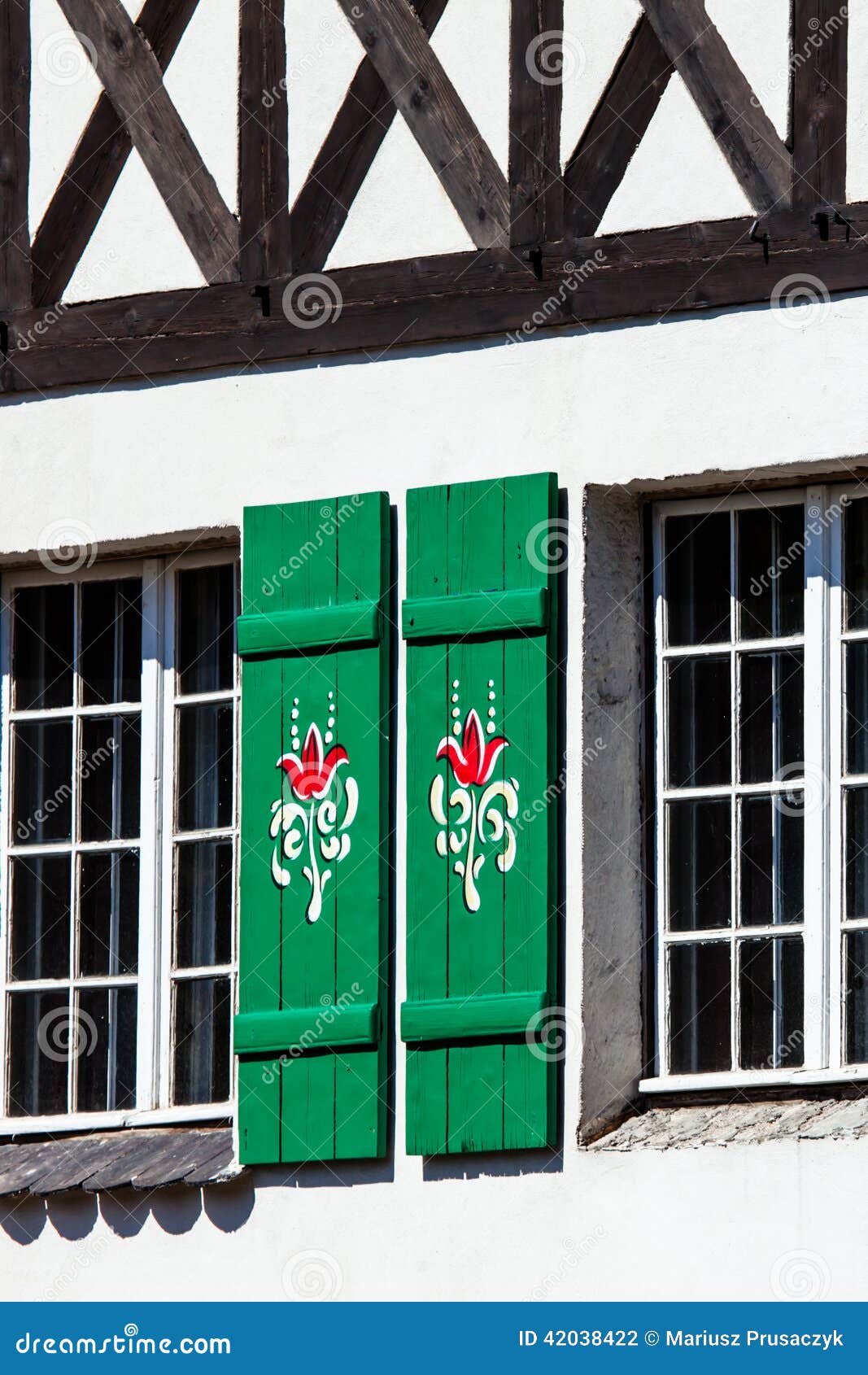 Typical Germany Windows with Green Shutters and Window Box Stock Photo
