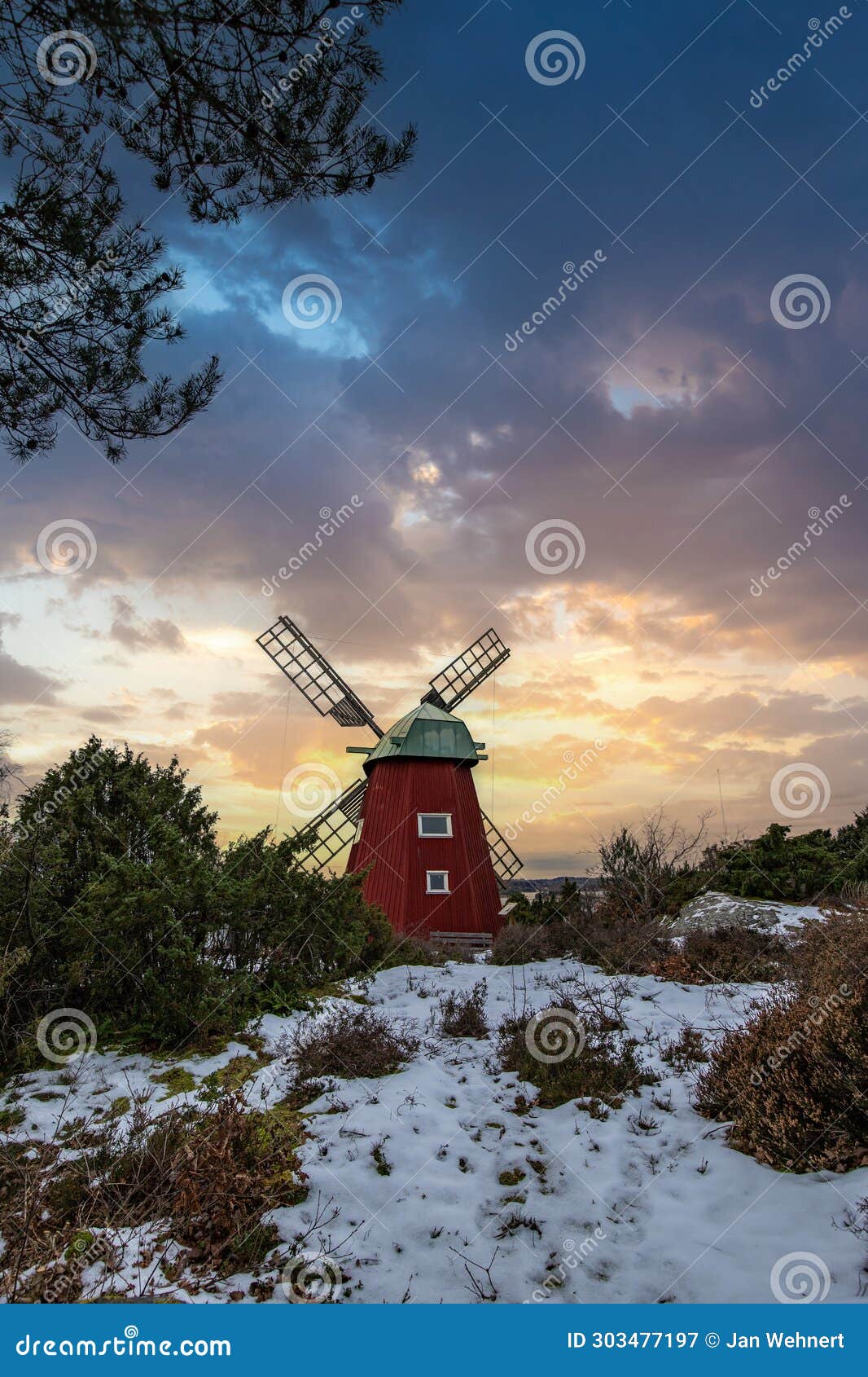 historical windmill made of red wood in a winter landscape.stenungsund in sweden