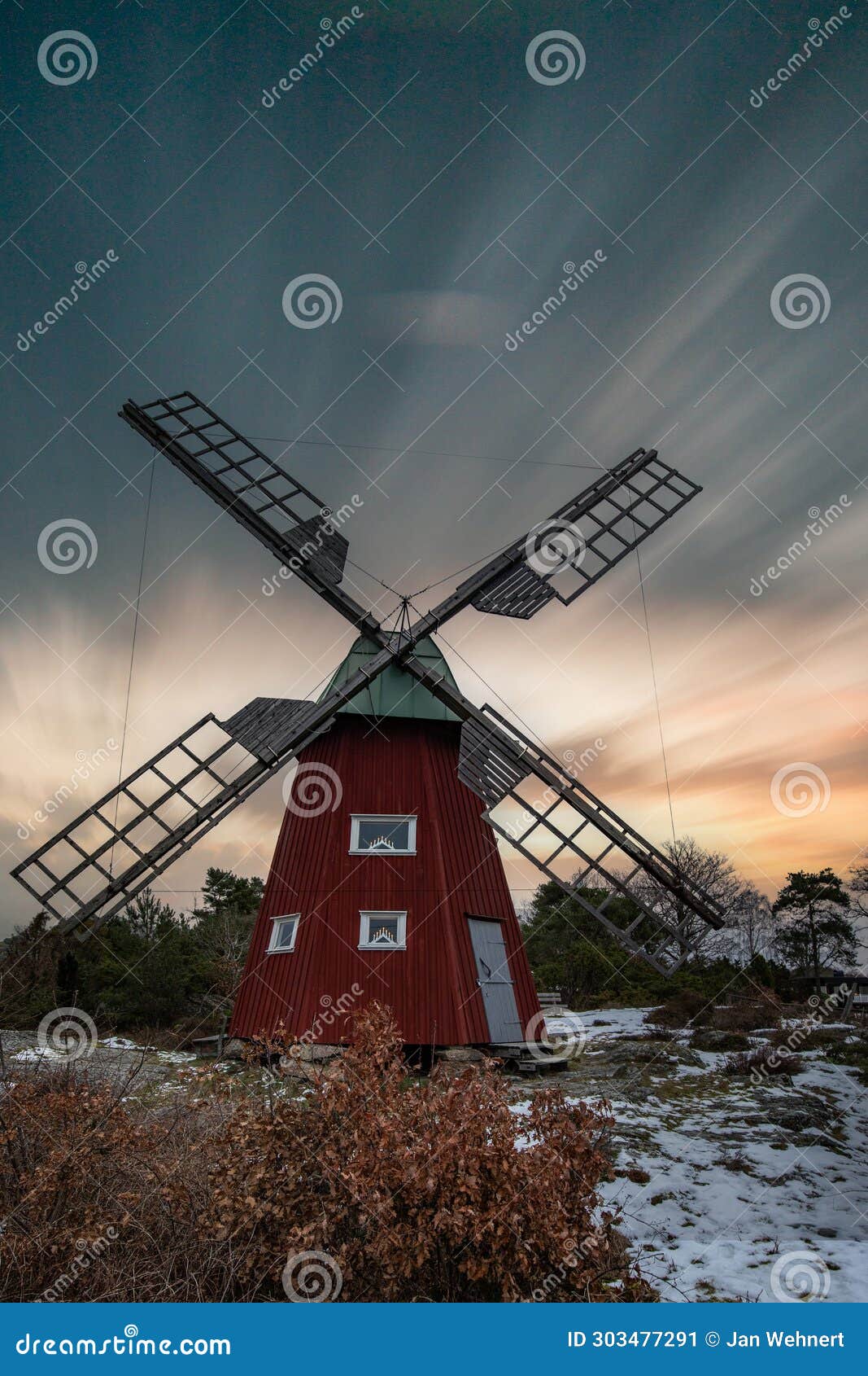 historical windmill made of red wood in a winter landscape.stenungsund in sweden