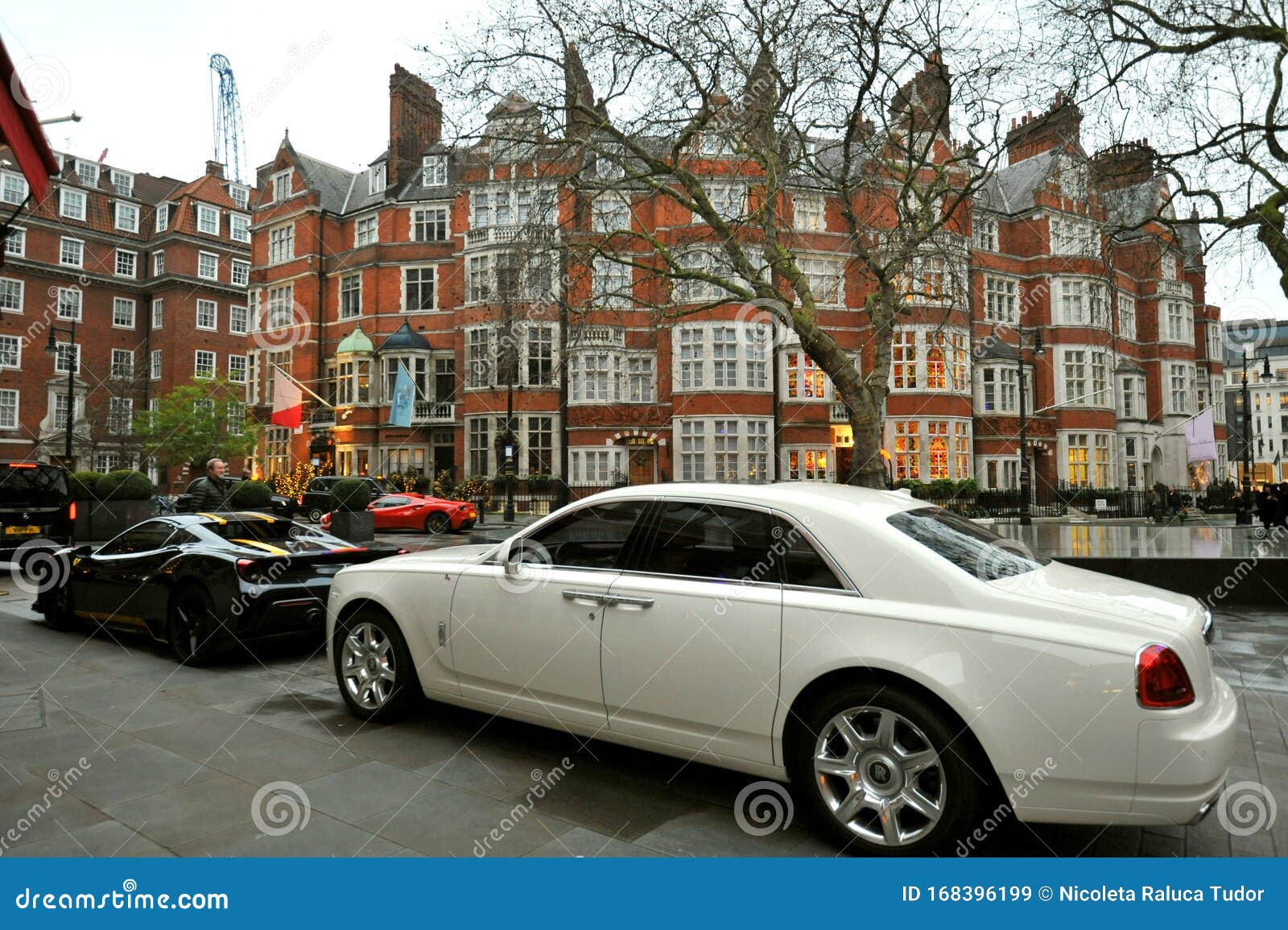 Typical House in Mayfair London with Luxury Cars Editorial Stock Image