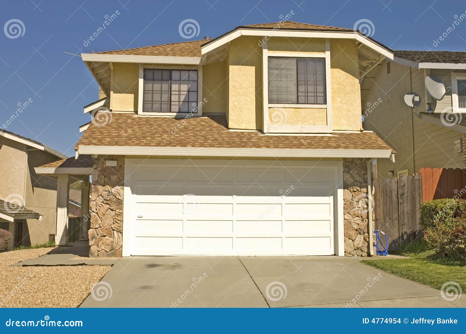 Typical modern tract home stock photo. Image of garage 4774954