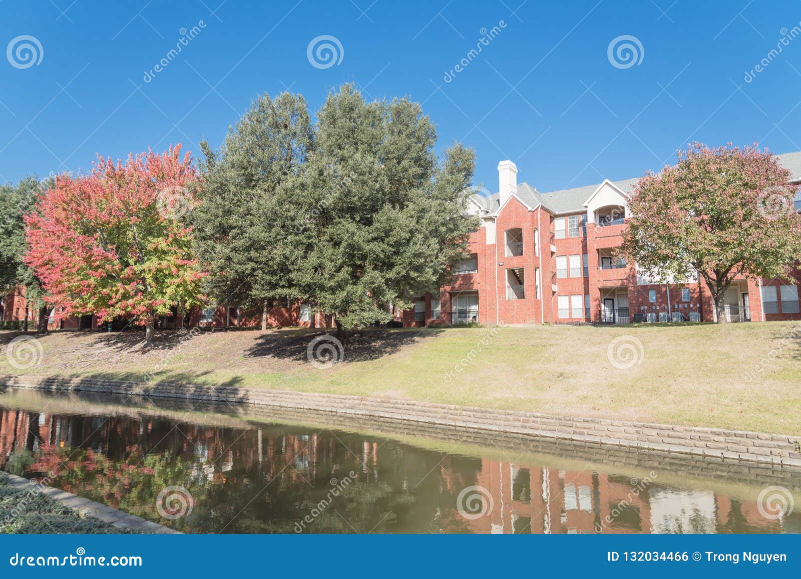 Typical Multistory Riverside Apartment Complex with Fall Foliage in