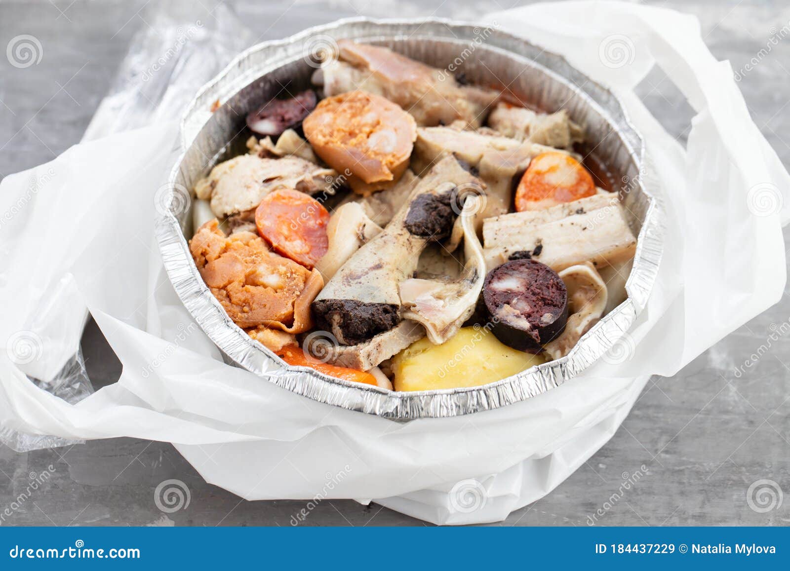 typical portuguese dish cozido a portuguesa in plastic box take away