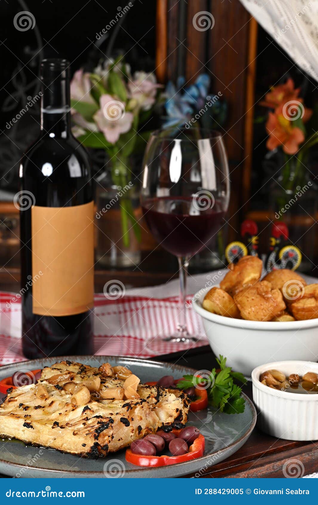 typical portuguese dish roasted codfish with onion garlic peppers and rustic babata lusitanian food