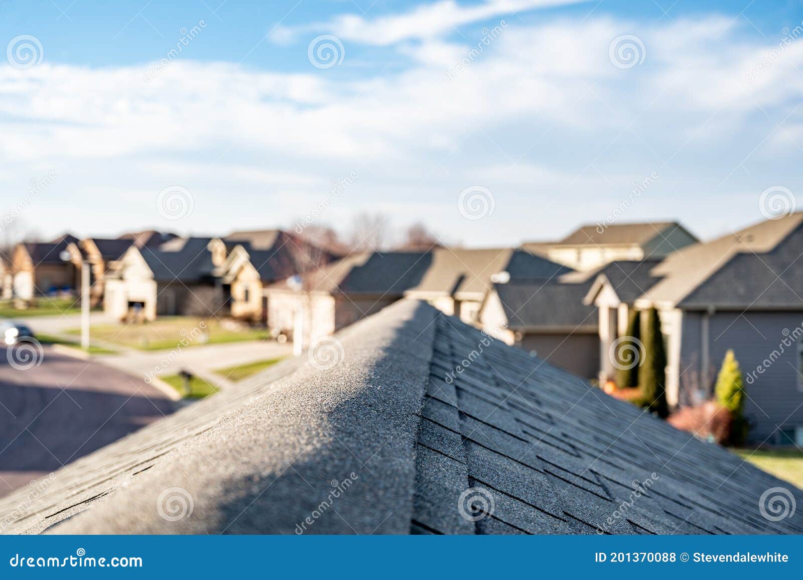 view down the top of an asphalt shingle roof with ridge cap