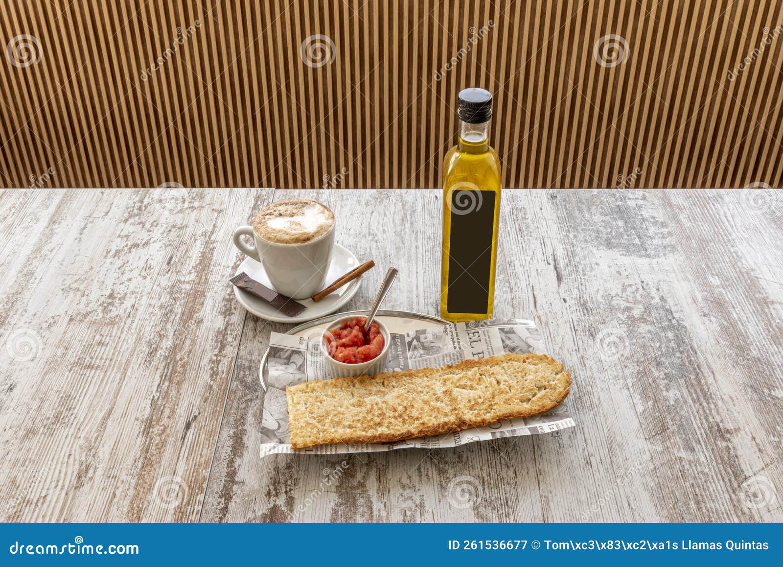 typical spanish breakfast of cafe con leche with toasted bread with tomato and olive oil