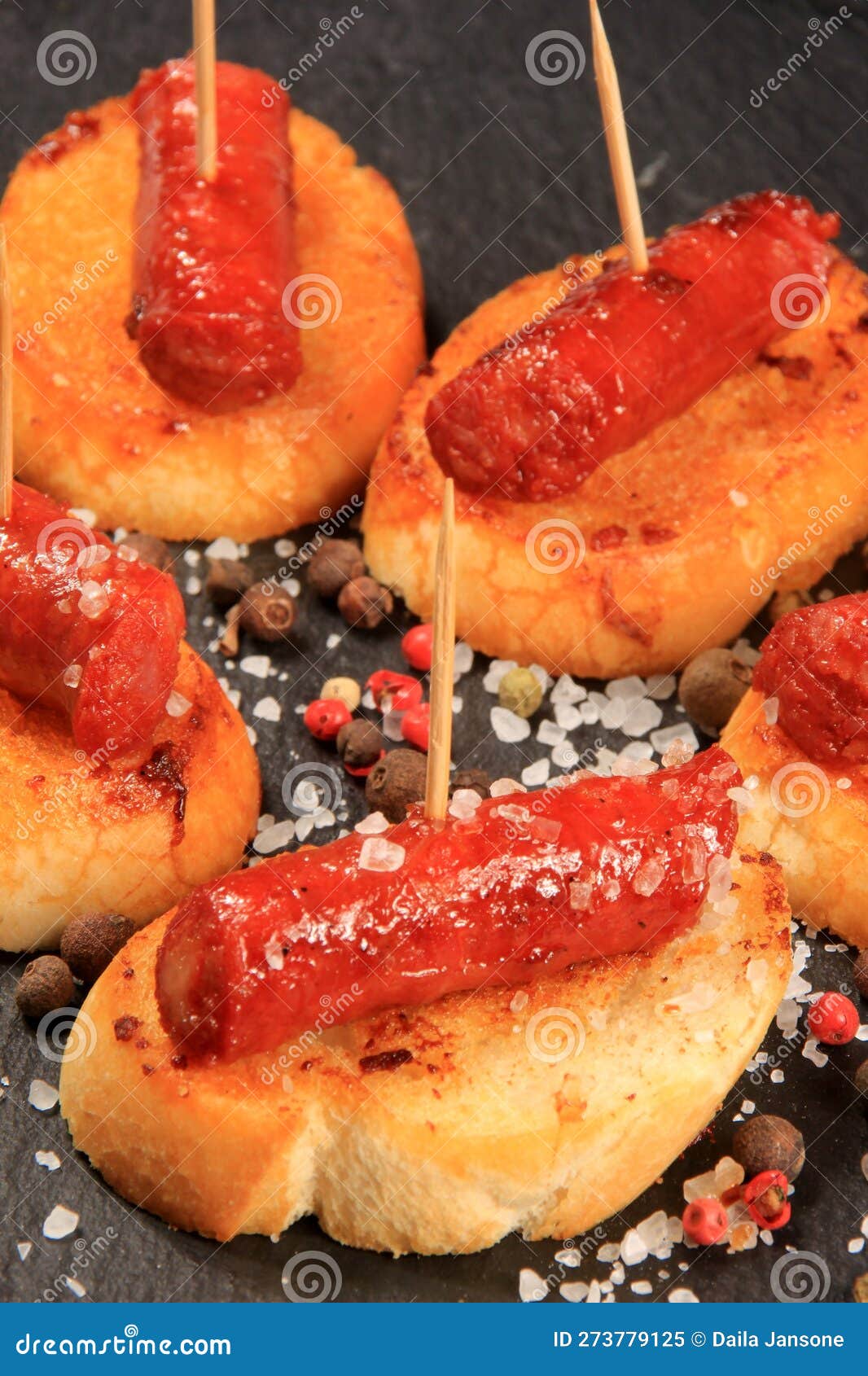 Typical Spanish Chorizo Tapas. Pork Sausage Called Chistorra on Bread