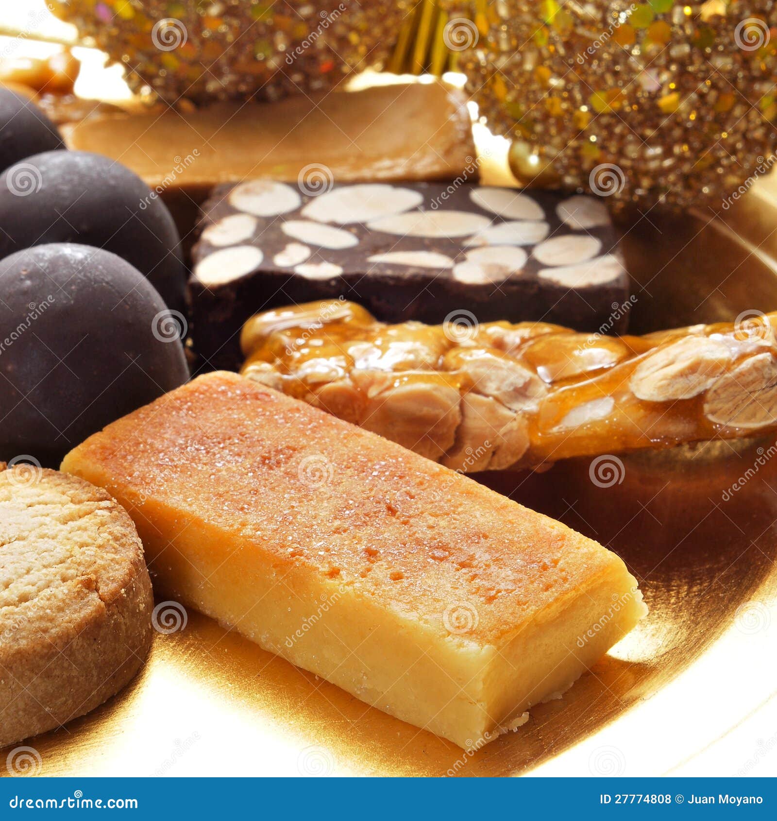 Closeup of a pile of turron, mantecados and polvorones, typical spanish christmas sweets