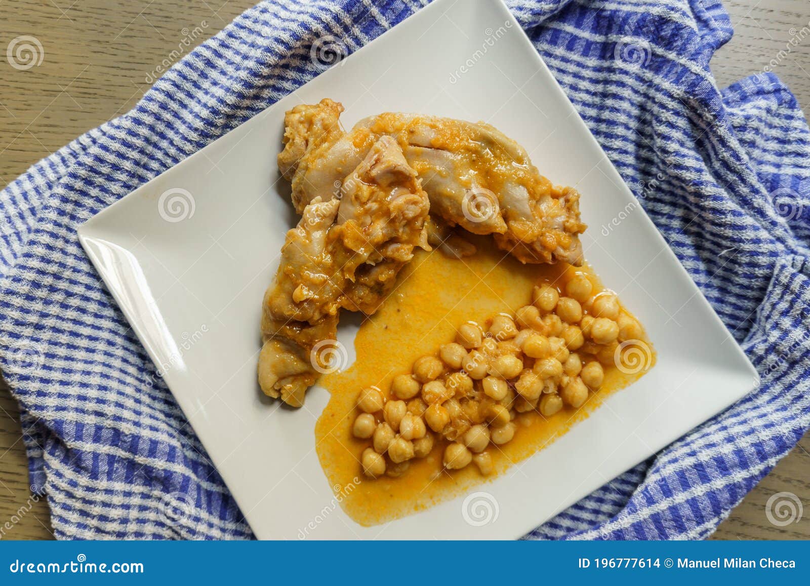 Typical Spanish Dish, Braised Pork Feet with Chickpeas Stock Photo Image of napkin, gastronomy