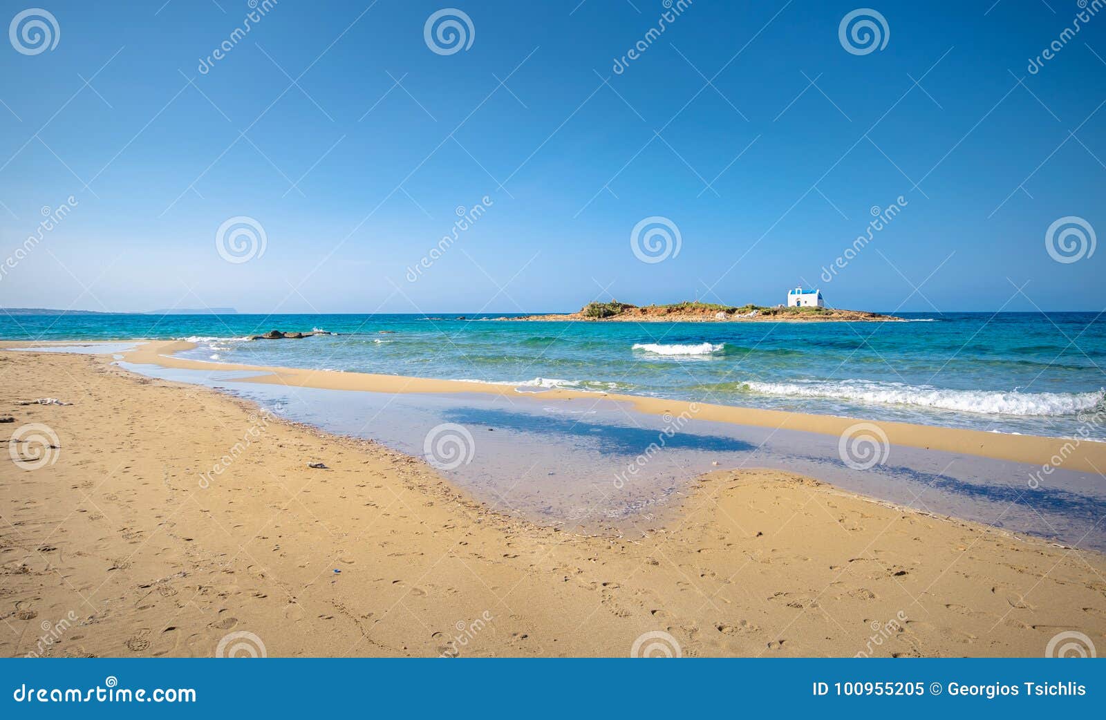 typical summer image of an amazing pictorial view of a sandy beach and an old white church in a small isl