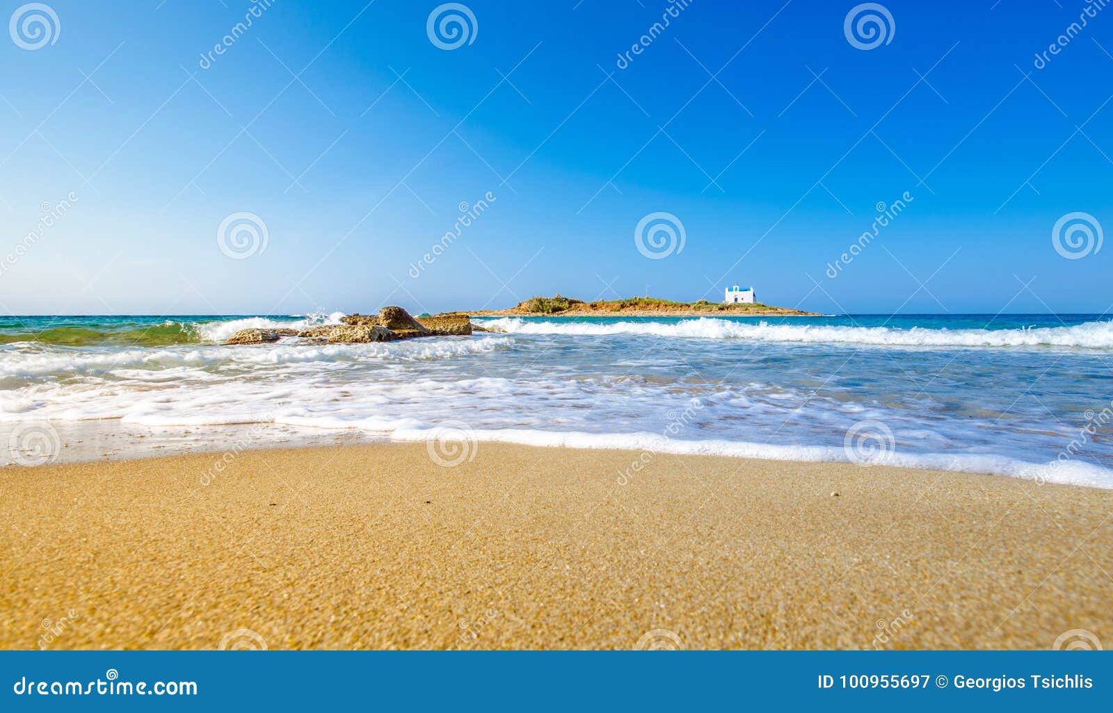 typical summer image of an amazing pictorial view of a sandy beach and an old white church in a small isl