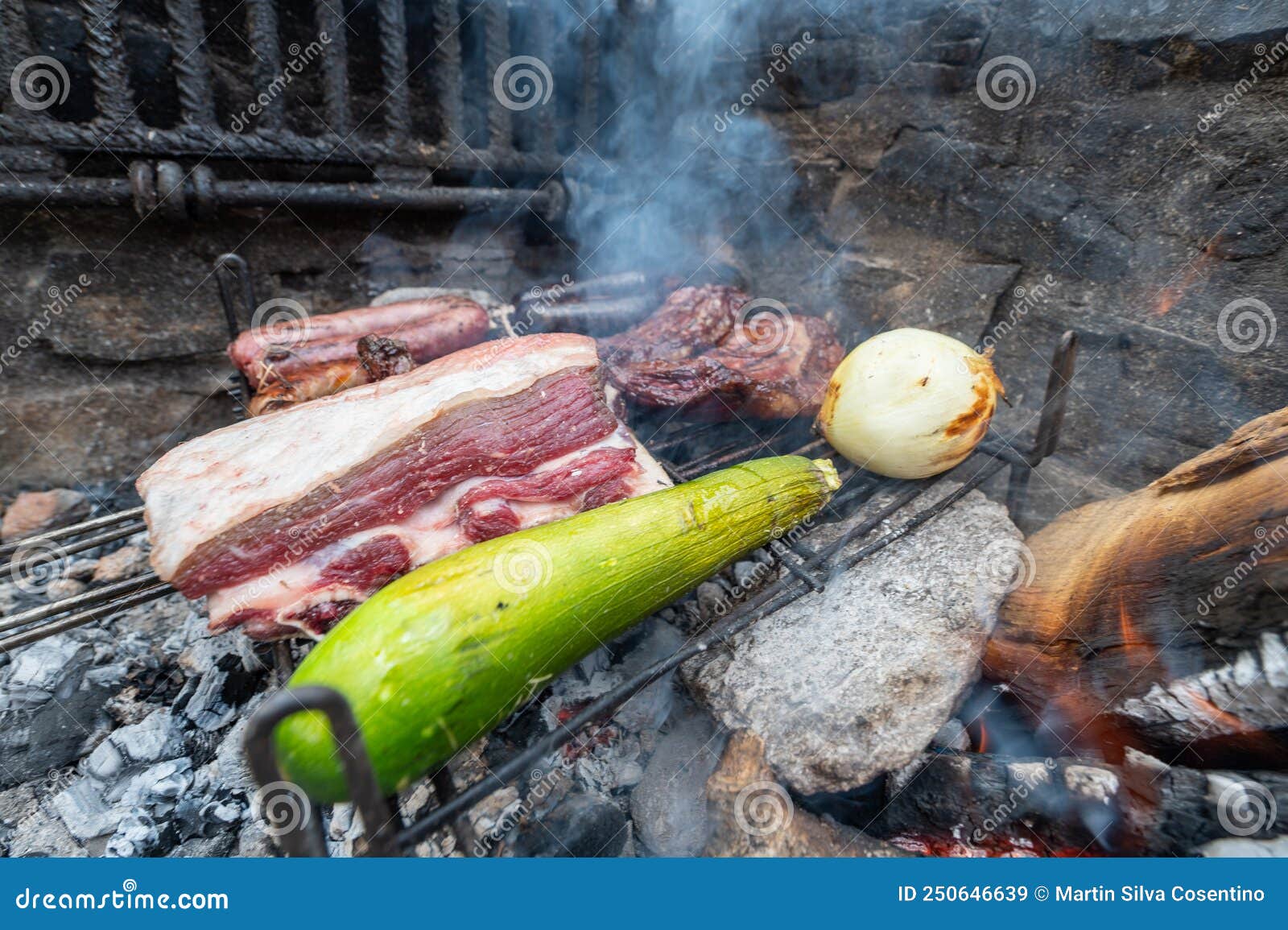 typical uruguayan and argentine asado cooked on fire. entrana and vacio meat cuts. accompanied with chorizo