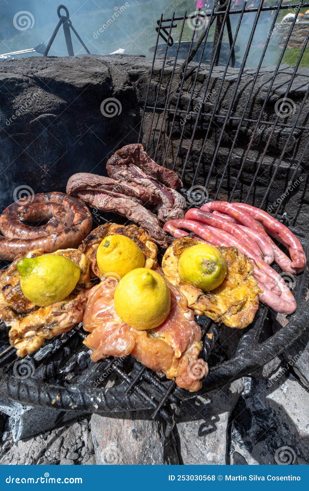 typical uruguayan and argentine asado cooked on fire. entrana and vacio meat cuts. accompanied with chorizo