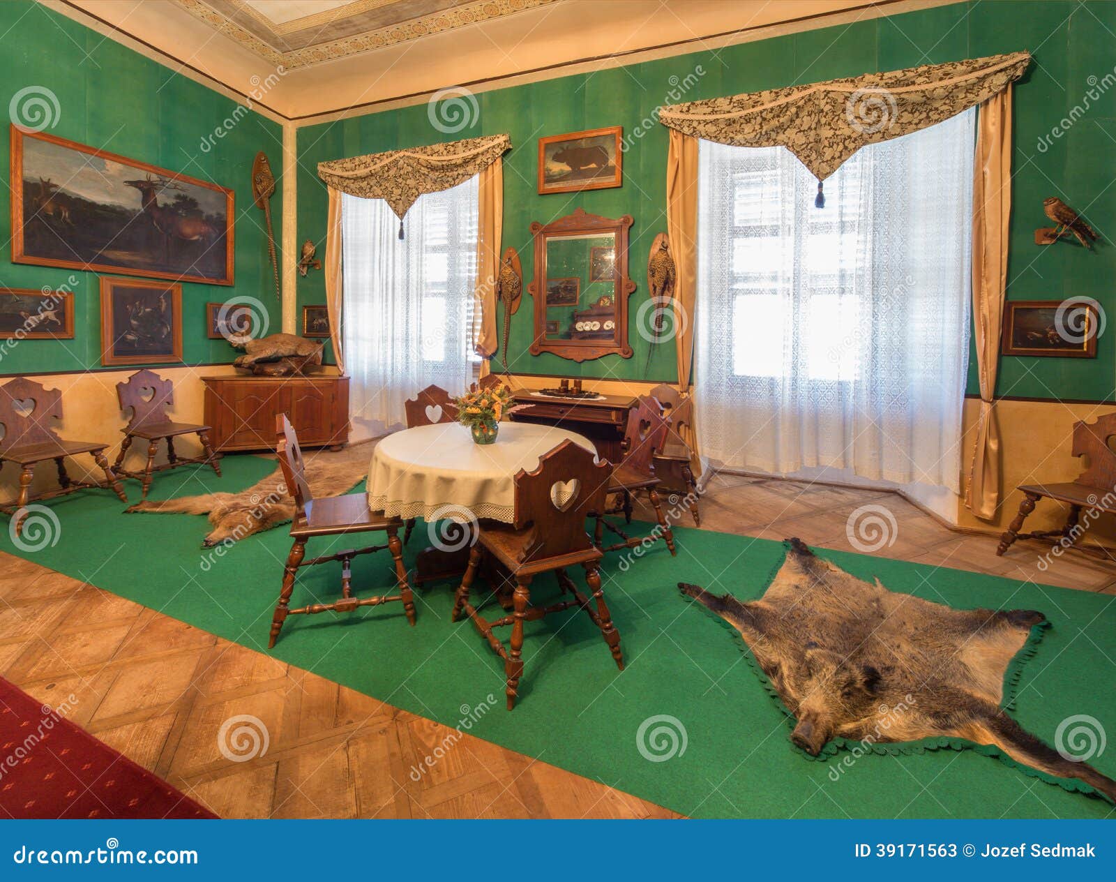 SAINT ANTON, SLOVAKIA - FEBRUARY 26, 2014: Tyrols hunter eating room in palace Saint Anton from 19. cent..