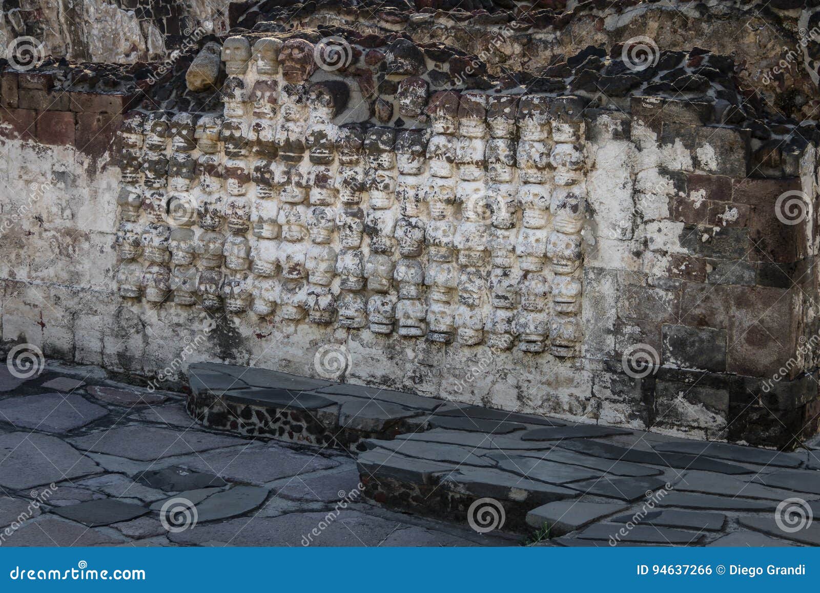 tzompantli altar with carved skulls rows in aztec temple templo mayor at ruins of tenochtitlan - mexico city, mexico
