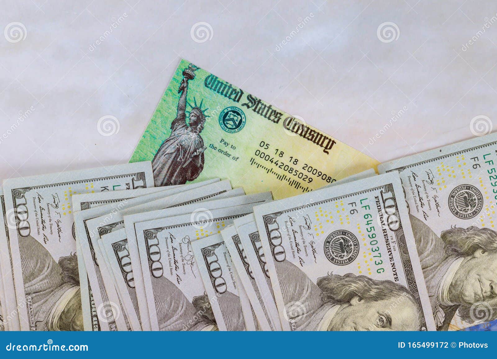 1040 u.s. individual income tax return, stimulus economic tax return check and usa currency hundred us dollar bills
