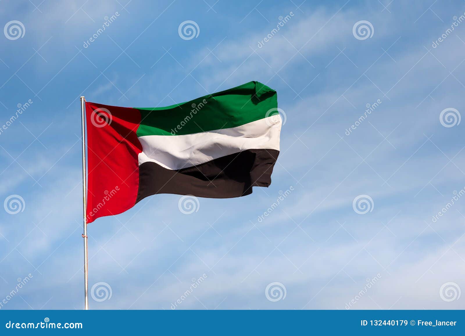 UAE Flag Waving In The Sky, National Symbol Of UAE. UAE National Day