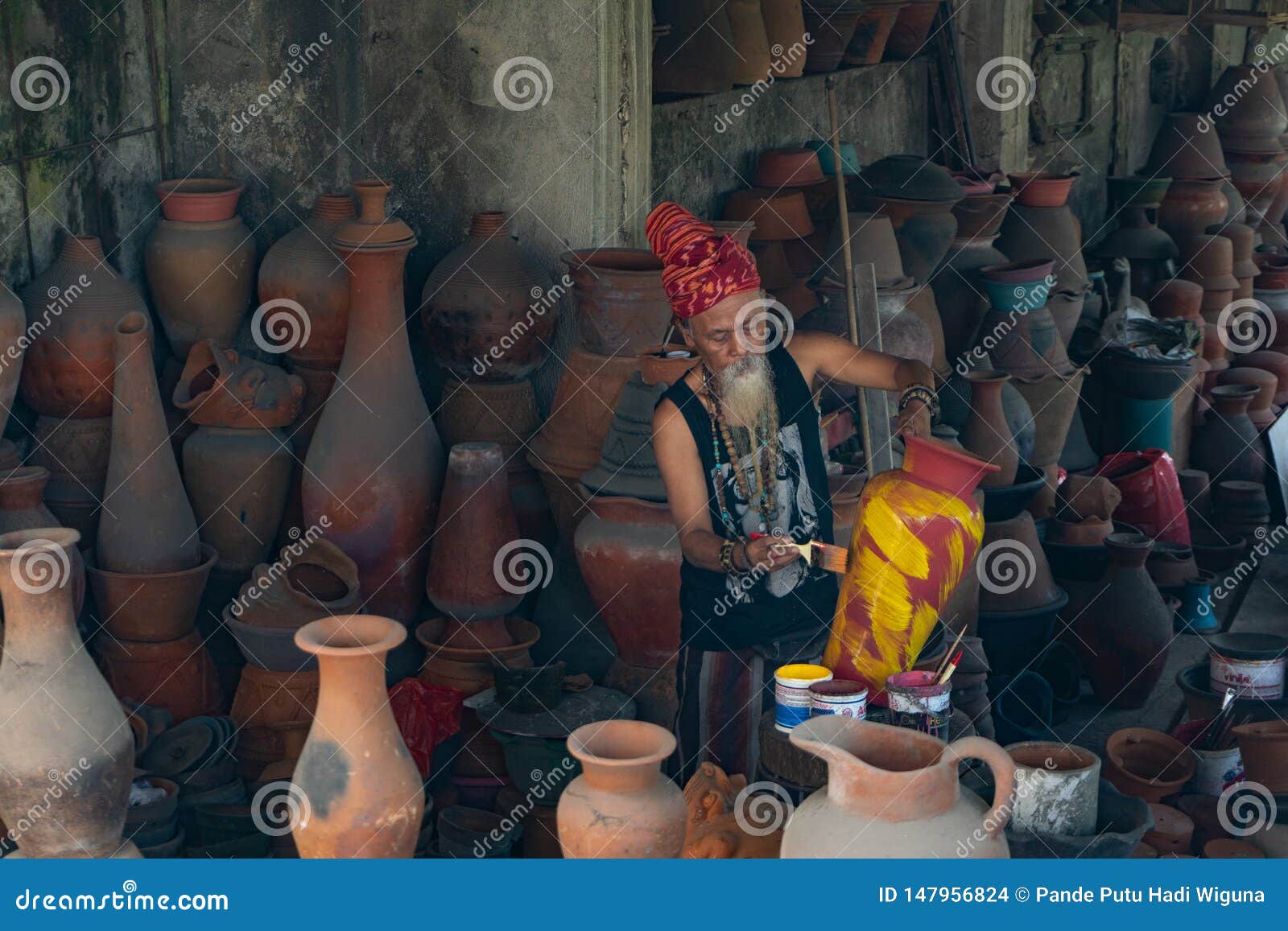 UBUD, BALI-APRIL 27 2019-an Old White-bearded Pottery Craftsman Wearing