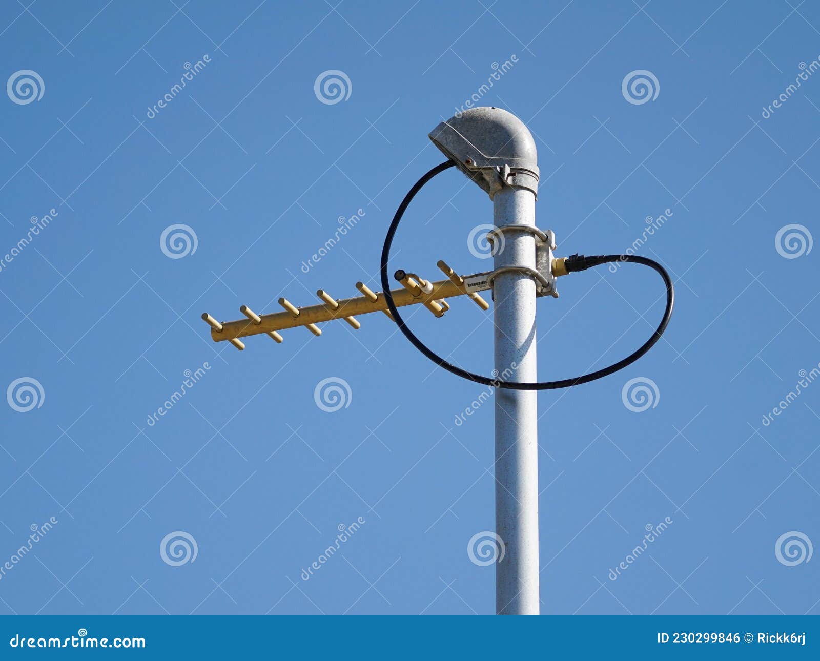 UHF Radio Antenna on Pole Against Blue Sky Landscape Format Stock Photo