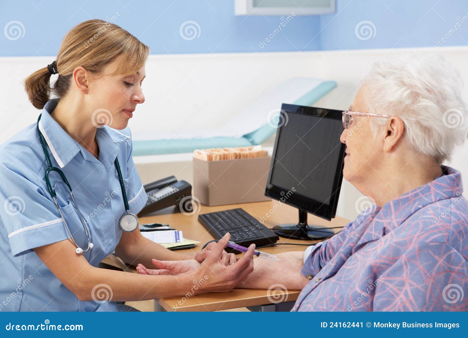 uk nurse injecting senior woman patient